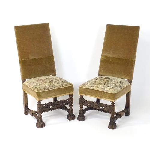 593 - A pair of late 19thC side chairs with rectangular backrests above sprung seats and carved oak legs w... 