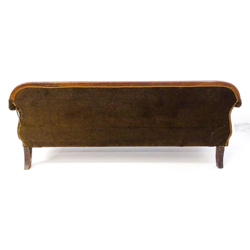 596 - A 19thC mahogany sofa with a moulded top rail above upholstered backrest and sprung seat, the scroll... 