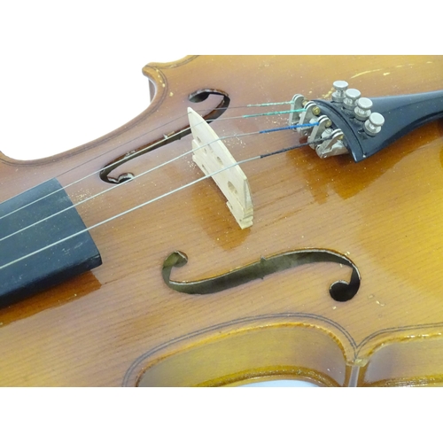 183 - A cased student's violin, labelled 'Lark' to the interior. Approx 22