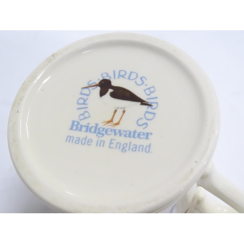 237 - Seven Emma Bridgewater mugs, to include Tea / Coffee / Hot Chocolate, Oxford, Swallow, Avocets, Daff... 