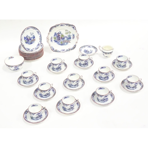 253 - A quantity of Taylor & Kent tea wares with chinoiserie decoration, to include cups, saucers, milk ju... 