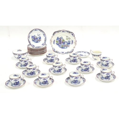 253 - A quantity of Taylor & Kent tea wares with chinoiserie decoration, to include cups, saucers, milk ju... 