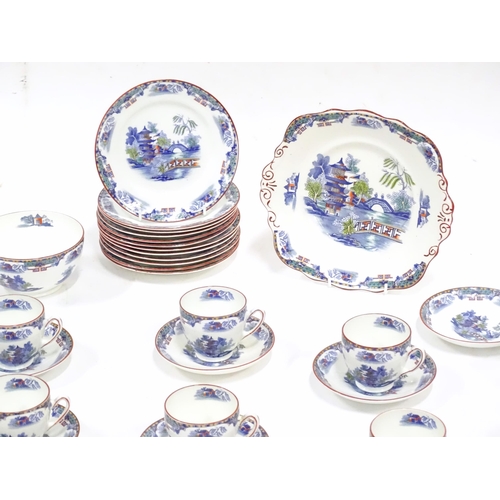 253 - A quantity of Taylor & Kent tea wares with chinoiserie decoration, to include cups, saucers, milk ju... 