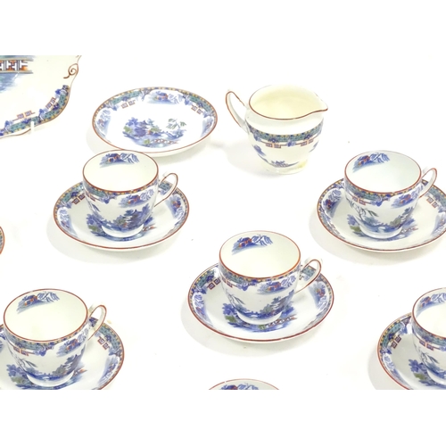 253 - A quantity of Taylor & Kent tea wares with chinoiserie decoration, to include cups, saucers, milk ju... 