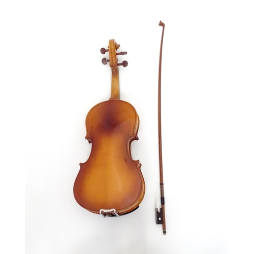 183 - A cased student's violin, labelled 'Lark' to the interior. Approx 22