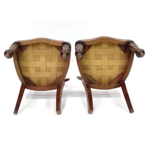 312 - A pair balloon back dining chairs with carved mid rails and raised on reeded tapering front legs