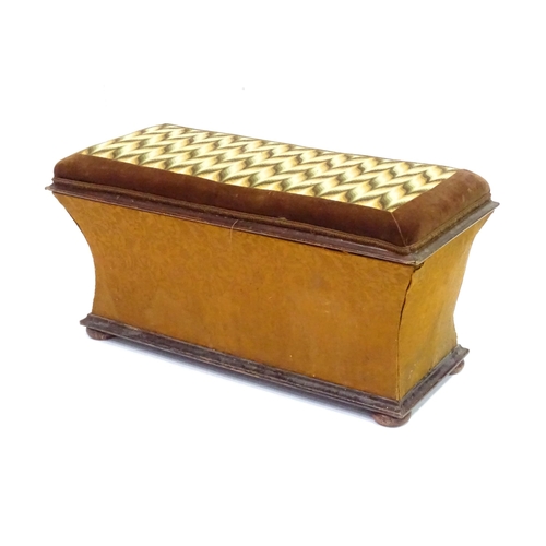 333 - A 20thC Ottoman with upholstered hinged top and raised on squat bun feet measuring . Approx 30