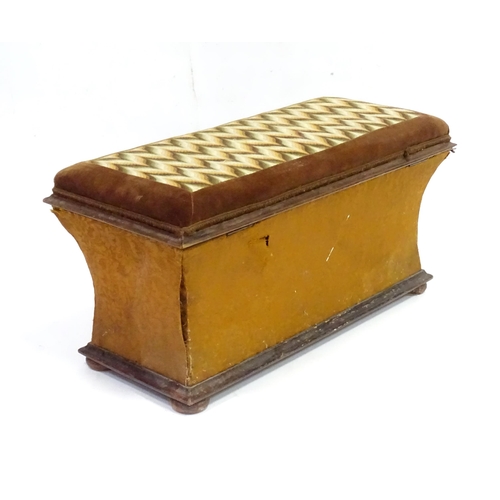 333 - A 20thC Ottoman with upholstered hinged top and raised on squat bun feet measuring . Approx 30