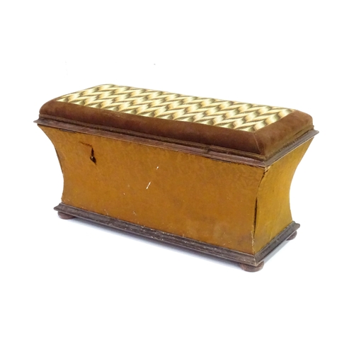 333 - A 20thC Ottoman with upholstered hinged top and raised on squat bun feet measuring . Approx 30