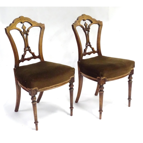 346 - A pair of early 20thC walnut side chairs raised on fluted tapering front legs