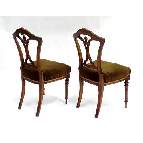 346 - A pair of early 20thC walnut side chairs raised on fluted tapering front legs