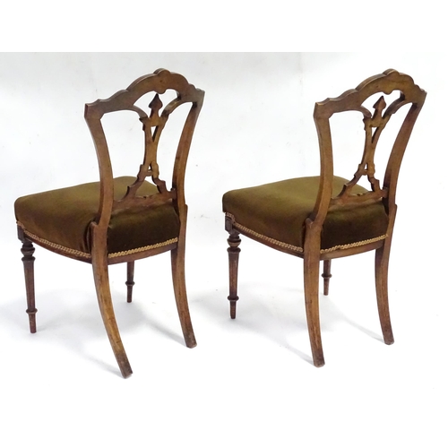 346 - A pair of early 20thC walnut side chairs raised on fluted tapering front legs