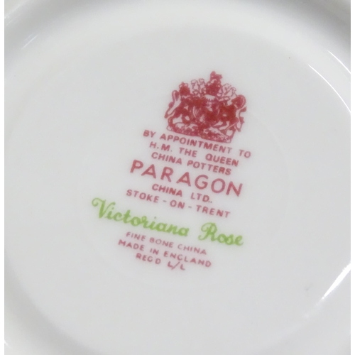 352 - A quantity of tea / dinner wares in the Victoriana Rose pattern to include, tea cups and saucers, pl... 