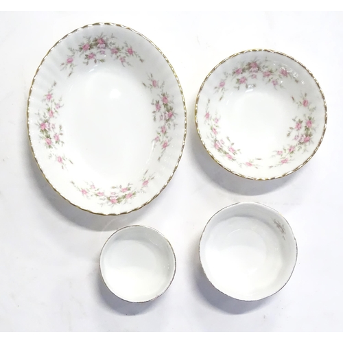 352 - A quantity of tea / dinner wares in the Victoriana Rose pattern to include, tea cups and saucers, pl... 