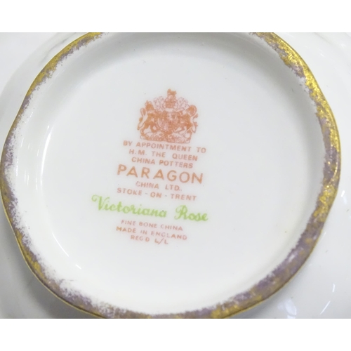 352 - A quantity of tea / dinner wares in the Victoriana Rose pattern to include, tea cups and saucers, pl... 