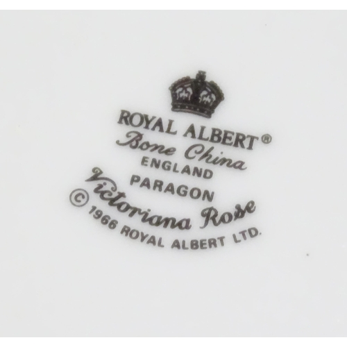 352 - A quantity of tea / dinner wares in the Victoriana Rose pattern to include, tea cups and saucers, pl... 