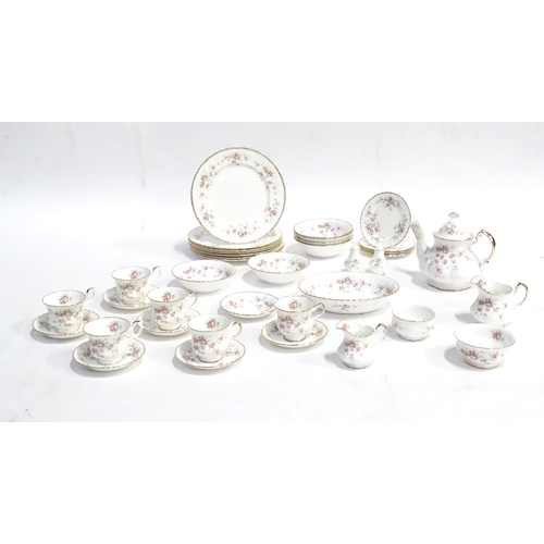 352 - A quantity of tea / dinner wares in the Victoriana Rose pattern to include, tea cups and saucers, pl... 