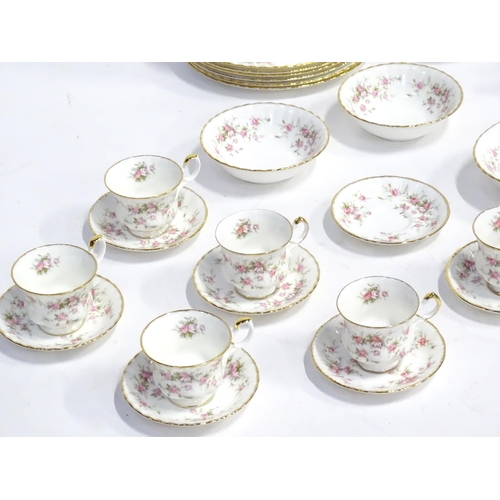 352 - A quantity of tea / dinner wares in the Victoriana Rose pattern to include, tea cups and saucers, pl... 