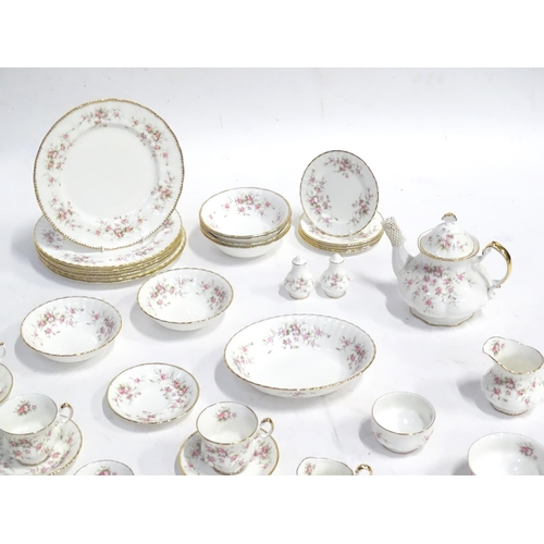 352 - A quantity of tea / dinner wares in the Victoriana Rose pattern to include, tea cups and saucers, pl... 