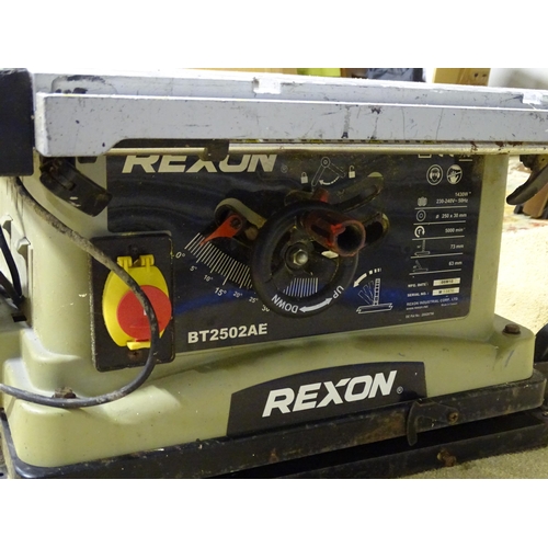 907 - A Rexon BT2502AE electric bench saw, with folding base and castors, together with an electric tile c... 