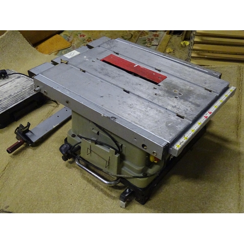 907 - A Rexon BT2502AE electric bench saw, with folding base and castors, together with an electric tile c... 