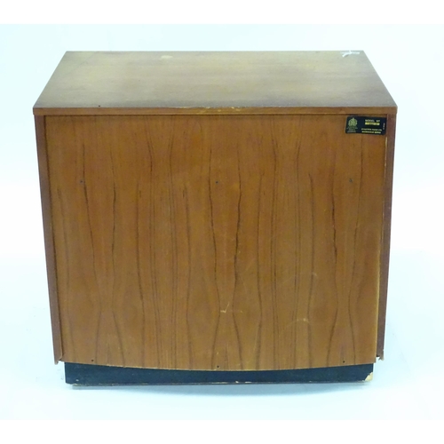 232 - A retro teak record cabinet containing assorted vinyl records to include Louis Armstrong, Kenny Bake... 