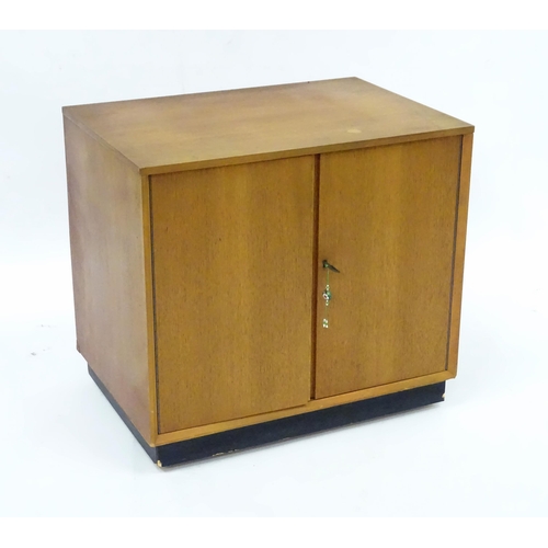 232 - A retro teak record cabinet containing assorted vinyl records to include Louis Armstrong, Kenny Bake... 