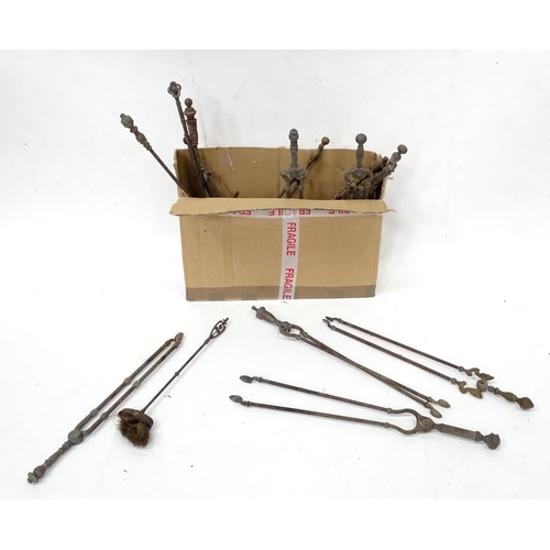 377 - A quantity of assorted fire tools to include shovels, tongs etc.