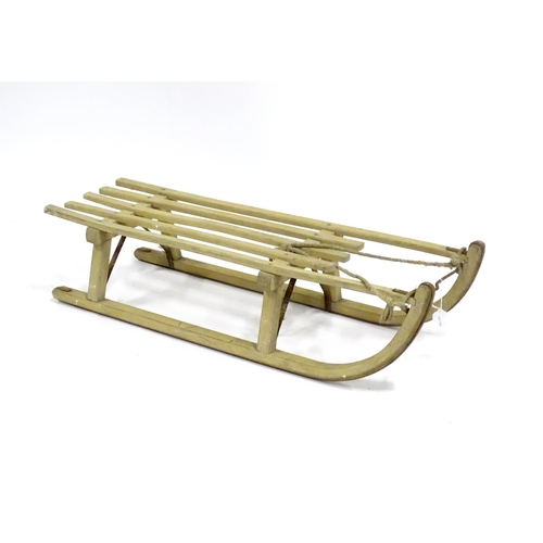 A wooden toboggan / sledge. Approx 39 1/2" long
