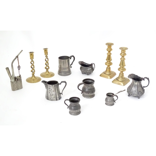 113 - A quantity of assorted pewter and brass wares, to include candlesticks, tankards, etc.