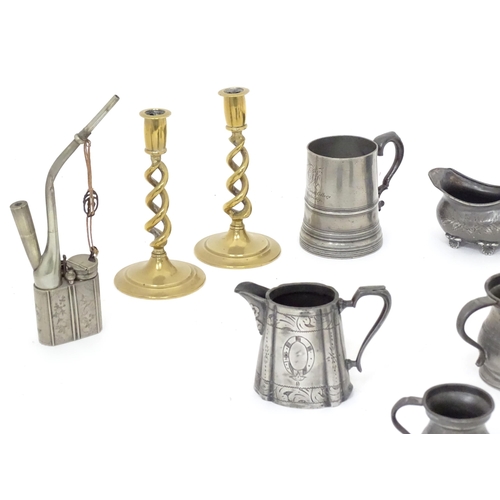 113 - A quantity of assorted pewter and brass wares, to include candlesticks, tankards, etc.