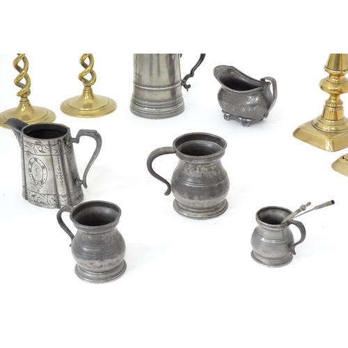 113 - A quantity of assorted pewter and brass wares, to include candlesticks, tankards, etc.