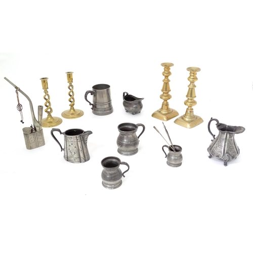 113 - A quantity of assorted pewter and brass wares, to include candlesticks, tankards, etc.