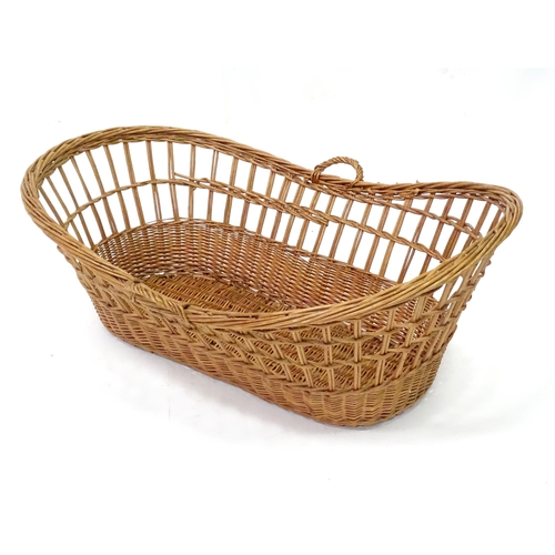 129 - Wicker / cane baby basket. Approx 37