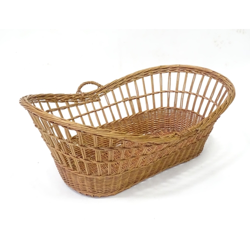 129 - Wicker / cane baby basket. Approx 37