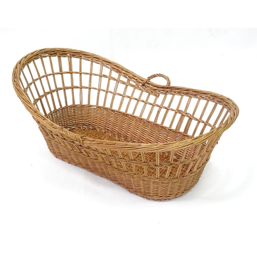 129 - Wicker / cane baby basket. Approx 37