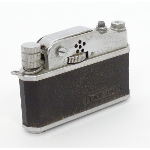 473 - A novelty lighter formed as a camera. Approx. 2 1/2