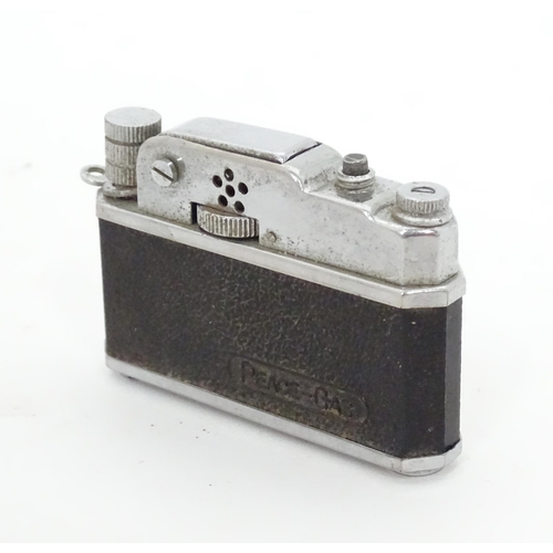 473 - A novelty lighter formed as a camera. Approx. 2 1/2