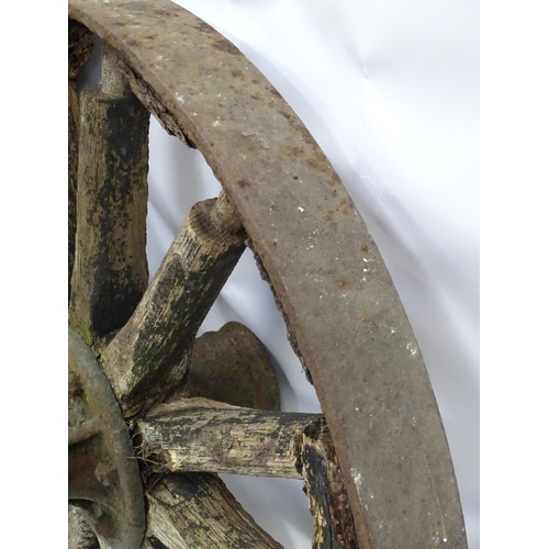 79 - An old cart wheel. Approx 36