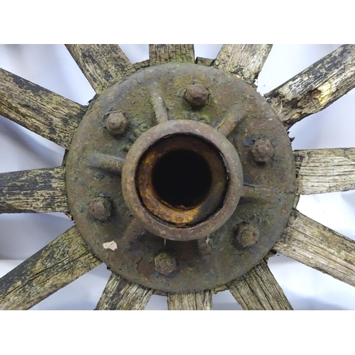 79 - An old cart wheel. Approx 36