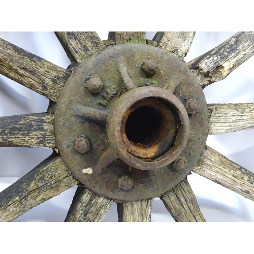 79 - An old cart wheel. Approx 36
