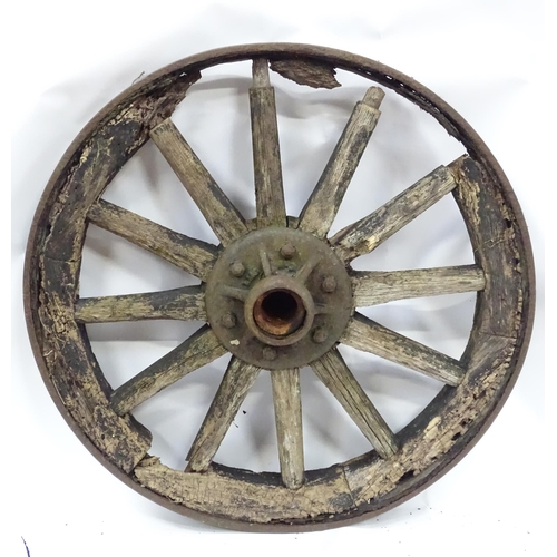 79 - An old cart wheel. Approx 36