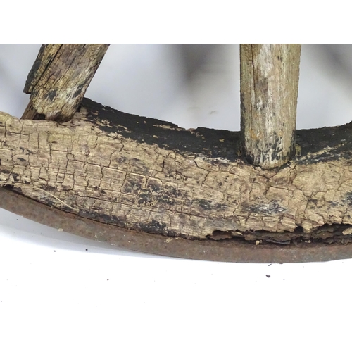 79 - An old cart wheel. Approx 36
