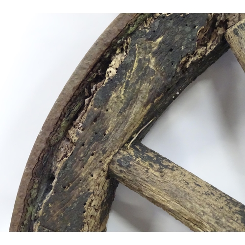 79 - An old cart wheel. Approx 36