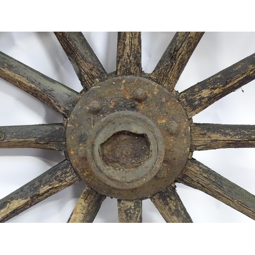 79 - An old cart wheel. Approx 36