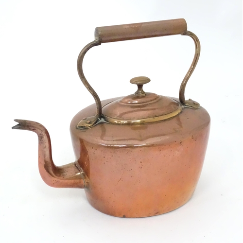 83 - Two bed warming pans and a copper kettle (3)