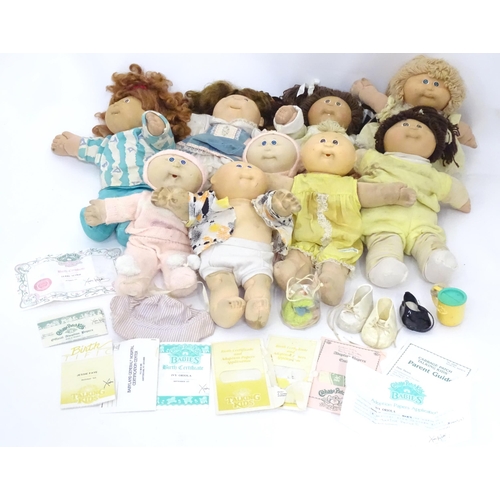85 - Toys: A quantity of assorted Cabbage Patch Kids dolls etc - some with certificates, to include a Tal... 