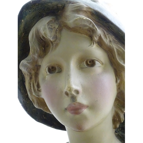 91 - After Richard Aurili (1834-1914), An Italian plaster bust depicting a young lady wearing a hat, with... 