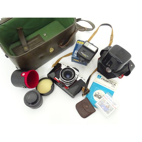 93 - A quantity of film and digital cameras to include a cased Nikon F-401s camera, a cased Pentacon Prak... 