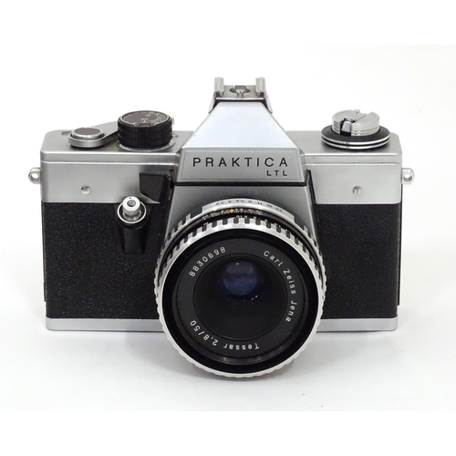 93 - A quantity of film and digital cameras to include a cased Nikon F-401s camera, a cased Pentacon Prak... 